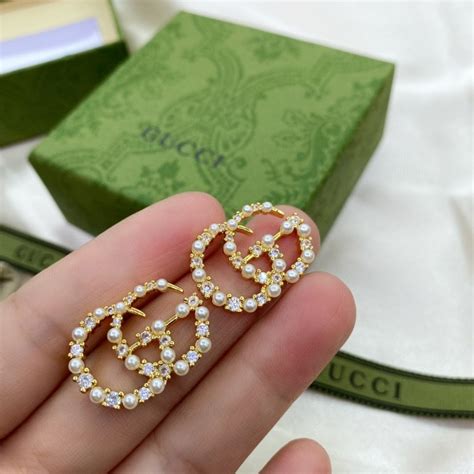 Gucci stud earrings with half pearl 